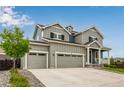 Attractive home with a three-car garage, enhanced by a beautifully designed front yard and mature trees at 10 N Quantock St, Aurora, CO 80018