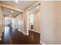 Spacious entry hallway with hardwood floors and neutral paint tones at 13912 Ashgrove Cir, Parker, CO 80134