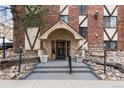 An inviting entrance with planters leads to the Riviera Park Condominiums at 1008 N Corona St # 405, Denver, CO 80218