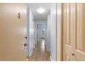 Bright hallway with wood-look floors and a neutral color palette offering a clean, modern feel at 1008 N Corona St # 405, Denver, CO 80218
