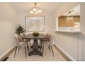 Inviting dining room featuring modern light fixture, stylish table, and a serene atmosphere for Gathering meals at 10490 W Jewell Ave # D, Lakewood, CO 80232