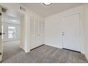 A spacious hallway offers access to bedrooms, closet, and the exterior door at 3550 S Harlan St # 182, Denver, CO 80235