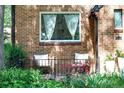 Cozy front porch with seating area and lush landscaping, perfect for relaxing outdoors at 1661 Oneida St, Denver, CO 80220