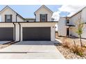Charming two-story home with a two-car garage and well-maintained front yard at 551 S Main St, Byers, CO 80103