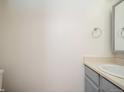 Neutral powder bath with a vanity and stylish fixtures at 11147 W 17Th Ave # 105, Lakewood, CO 80215
