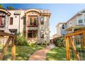 Beautiful front exterior with stone accents, a charming yard, and a private walkway at 2034 Newton St, Denver, CO 80211