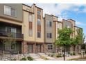 Stylish townhomes with attractive siding, stone accents, and well-maintained landscaping at 11132 Via Lata Dr, Broomfield, CO 80020