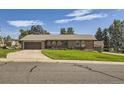 Ranch style home with a nicely landscaped yard at 13627 W Alaska Dr, Lakewood, CO 80228