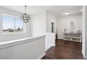 Bright entryway with wood floors and elegant decor at 1180 Antelope W Dr, Bennett, CO 80102