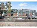 Front view of building with parking and landscaping at 3526 S Depew St # 101, Lakewood, CO 80235