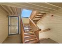 Indoor view of a wooden staircase leading to upper levels at 444 S Kittredge St # 205, Aurora, CO 80017