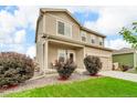 Charming two-story home with landscaped front yard, gravel beds, and attached two-car garage at 7218 Animas Ave, Frederick, CO 80530