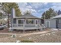 Cozy home featuring a deck, and landscaped front yard at 8100 W Quincy Ave # D, Denver, CO 80123