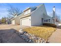 Beautiful townhome with attached garage and manicured lawn at 10588 E Park Mtn, Littleton, CO 80127