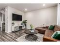 Inviting living room with stylish furnishings and hardwood flooring at 5187 S Fairplay St, Aurora, CO 80015