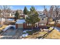 Aerial view of a charming two-story home with mature trees in a quiet neighborhood at 6940 S Uinta St, Centennial, CO 80112