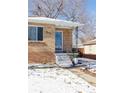 Brick home's front entrance with steps and landscaping at 3151 S Corona St, Englewood, CO 80113