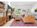 Cozy living room with a decorative fireplace, comfortable seating, and natural light at 480 S Grant St, Denver, CO 80209