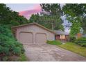 Inviting exterior view of a home with a two car garage and well kept yard at 2648 S Wadsworth Way, Lakewood, CO 80227