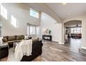 Spacious living room with soaring ceilings, large windows, and an open layout at 4968 Montvale Dr, Highlands Ranch, CO 80130