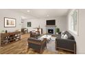 Inviting living room with fireplace, stylish furniture, and bright natural light at 3193 W 134Th Cir, Broomfield, CO 80020