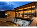 Home with walls of windows allowing light to flood into the house, offering stunning mountain views at 17401 Snowcreek Ln, Morrison, CO 80465