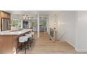 Open-concept design showcases the kitchen island and flows into the living and dining spaces at 41 Eagle Dr, Littleton, CO 80123