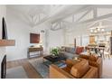 Inviting living room featuring vaulted ceilings with exposed beams and comfortable seating at 41 Eagle Dr, Littleton, CO 80123