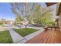 View from the porch showing the neighborhood street and well-kept front yard at 7875 Cyd Dr, Denver, CO 80221
