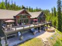 Gorgeous mountain home with an entertainment deck including a hot tub and gas firepit at 1279 Estates Dr, Breckenridge, CO 80424