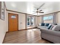Inviting living room featuring hardwood floors, natural light, and stylish furnishings at 6981 Zuni St, Denver, CO 80221