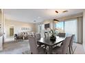 Bright living room and dining room with a fireplace, plush seating, and lots of natural light at 2500 E Cherry Creek South Dr # 213, Denver, CO 80209