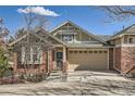 Inviting single-Gathering home featuring a classic brick facade and attached garage at 6776 E Panorama Ln # C1, Denver, CO 80224