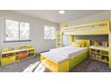 Fun yellow bunk bed and storage in bedroom at 3754 S Mission Pkwy, Aurora, CO 80013