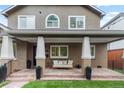 Charming front porch with stone flooring and comfortable seating area at 1366 S Vine St, Denver, CO 80210
