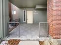 Inviting front porch featuring stylish gray tiles and modern railings at 11267 Central Ct, Broomfield, CO 80021