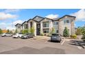 Well-maintained two-story condominium building with stone details at 875 E 78Th Ave # 52, Denver, CO 80229