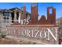 City Horizon Apartments sign on a brick base and metal ornamentation at 875 E 78Th Ave # 52, Denver, CO 80229