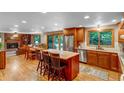 Open concept kitchen featuring an island, stainless appliances, and hardwood floors at 2775 Crabapple Rd, Golden, CO 80401