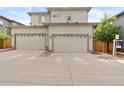 Attached two-car garage with contemporary doors, driveway, and neutral siding at 239 W Jamison Ct, Littleton, CO 80120