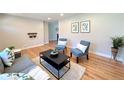 Bright and open living room with hardwood floors, natural light, and a comfortable seating arrangement at 2274 S Newton St, Denver, CO 80219