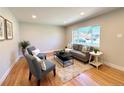 Cozy living room with lots of natural light, hardwood floors, neutral paint, and a stylish and comfortable seating area at 2274 S Newton St, Denver, CO 80219
