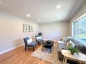Bright living room with hardwood floors, neutral walls, and plush seating for a comfortable and inviting atmosphere at 2274 S Newton St, Denver, CO 80219