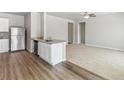 Open-concept kitchen with stainless steel appliances and a view to the living room at 869 Sawdust Dr, Brighton, CO 80601