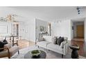 Spacious living room with hardwood floors, white walls and modern furnishings at 700 N Washington St # 502, Denver, CO 80203