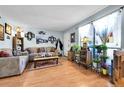 Inviting living room with a comfortable sofa, decorative accents, and natural light streaming through the windows at 3550 S Harlan St # 174, Denver, CO 80235