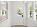 Bright entryway featuring a white front door with glass panel and sidelight windows at 539 Baker St, Longmont, CO 80501