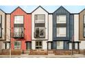 Three modern townhouses with unique exterior finishes at 5653 W 10Th Ave, Lakewood, CO 80214