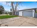 Long driveway leading to the house and garage, providing ample parking space and easy access at 415 Lamar St, Lakewood, CO 80226