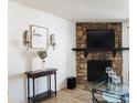 Inviting living room with stone fireplace and decorative accents at 14413 E Jewell Ave # 201, Aurora, CO 80012